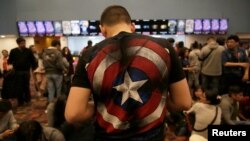 Fans of the Avengers series wait for an early premiere of "The Avengers: Endgame" movie in La Paz, Bolivia, April 24, 2019. 