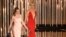 FILE - Emily Blunt, left, and Charlize Theron present an award at the Oscars in Los Angeles, Feb. 28, 2016. The actresses appear in "The Huntsman: Winter's War." 