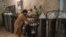 A worker fills oxygen tanks for use in hospitals in Peshawar, Pakistan, Dec. 7, 2020.