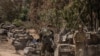 Israeli soldiers gather at a staging ground near the border with the Gaza Strip, in southern Israel, May 16, 2021. 