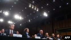 FILE - U.S. intelligence chiefs testify during a Senate Select Committee on Intelligence hearing on Capitol Hill, Jan. 29, 2019. The officials on Thursday did not rule out the possibility of forgoing the public portion of the annual hearings this year. 