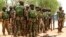 Soldiers stand during a parade in Baga village in the northeastern state of Borno May 13, 2013. 