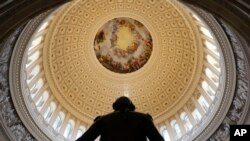 FILE - The Capitol Rotunda is seen with the statue of George Washington on Capitol Hill in Washington, Jan. 30, 2018.