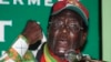 FILE: Zimbabwe's President Robert Mugabe gestures as he speaks to party supporters at the launch of his Presidential run-off campaign in the capital Harare May 25, 2008. 