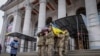 FILE - Fellow soldiers carry Petro Velykiy's coffin during a funeral, Nov. 27, 2024, at the theater in Chernyhiv, Ukraine, for the 48-year-old actor who was killed in a battle with Russian troops in the Kursk region. 