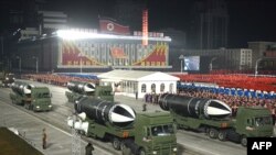 This picture taken on January 14, 2021 and released from North Korea's official Korean Central News Agency (KCNA) on January 15 shows what appears to be submarine-launched ballistic missiles during a military parade celebrating the 8th Congress of the Wor