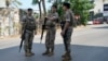 Lebanese security stand guard on a road that leads to the U.S. Embassy in Aukar, a northern suburb of Beirut, Lebanon, Wednesday, June 5, 2024. A gunman was captured by Lebanese soldiers after attempting to attack the U.S. Embassy near Beirut on Wednesday, the military said.