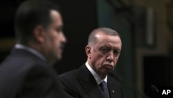 FILE - Turkey's President Recep Tayyip Erdogan, right, and Iraq's Prime Minister Mohammed Shia al-Sudani speak to the media after their talks, in Ankara, Turkey, March 21, 2023. Erdogan was set to make his first official visit to Iraq in more than a decade on April 22, 2024. 