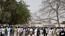 Voters queue to register during parliamentary elections in Kano, northern Nigeria, April 1, 2011