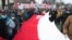 People take part in a rally against ongoing coronavirus restrictions, in Vienna, Austria, Jan. 31, 2021.
