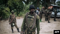 FILE - A Democratic Republic of Congo soldier is seen on patrol in the village of Manzalaho, near Beni, Feb. 18, 2020, following an alleged attack by members of the Allied Democratic Forces (ADF) rebel group.