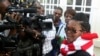 FILE - Zimbabwe's Lawyers For Human Rights (ZLHR) Board Member Beatrice Mtetwa speaks to the media outside the High Court after she was granted a $500 bail in Harare, March 25, 2013. 