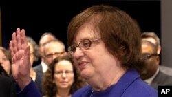FILE -Photo provided by the New York Attorney General's Office shows Solicitor General Barbara Underwood (R) taking the oath to become the state's acting Attorney General at the State Capitol in Albany, N.Y., May 7, 2018.