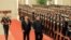 中国国家主席习近平在北京人民大会堂的欢迎仪式上同朝鲜国务委员会委员长金正恩检阅礼兵。（朝鲜官媒朝中社2018年3月28日对路透社发布的照片）。