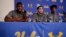 UCLA basketball player Cody Riley, left, reads his statement as he is joined by teammates LiAngelo Ball, center, and Jalen Hill during a news conference at UCLA, Nov. 15, 2017, in Los Angeles. 