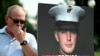 Joe Reed, the father of former U.S. Marine Trevor Reed, stands next to a placard of his son outside the U.S. Capitol in Washington, July 29, 2021. (Jim WATSON / AFP)