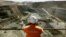 FILE - A miner looks across the largest open pit gold mine in Australia called the Fimiston Open Pit, also known as the Super Pit, in the gold-mining town of Kalgoorlie, located around 500 kilometres east of Perth, July 27, 2001. 