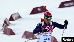 FILE - Norway's Ole Einar Bjoerndalen skis during the men's biathlon 10 km sprint event at the Sochi 2014 Winter Olympics in Rosa Khutor, Feb. 8, 2014.