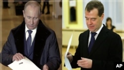 Russian Prime Minister Vladimir Putin, and Russian President Dmitry Medvedev cast their ballots in Moscow, December 4, 2011.