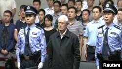 Zhou Yongkang, China's former domestic security chief, listens to his sentence in a court in Tianjin. This still image is taken from video provided by China Central Television and shot on June 11, 2015. 