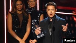 Robert Downey Jr. accepts the award for favorite action star, and also for favorite action movie and favorite movie for "Iron Man 3," at the 2014 People's Choice Awards in Los Angeles, California, January 8, 2014. 