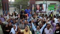 Supporters of former Pakistani Prime Minister Nawaz Sharif celebrate a court decision in favor of their leader, outside a hospital where he is receiving treatment, in Lahore, Pakistan, Oct. 29, 2019.