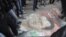 Demonstrators step on a picture of Syria's President Bashar al-Assad during a protest against his regime in Aleppo's Bustan al-Qasr district, Jan. 4, 2013.