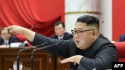 This picture taken Dec. 28-31, 2019, and released from North Korea's official Korean Central News Agency, Jan. 1, 2020, shows North Korean leader Kim Jong Un attending the 5th Plenary Meeting of the 7th Central Committee of the Workers' Party of Korea