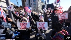 Supporters of impeached South Korean President Yoon Suk Yeol shout slogans during a rally to oppose his impeachment near the presidential residence in Seoul, South Korea, Jan. 10, 2025.