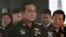 Thailand's Army commander Gen. Prayuth Chan-ocha (L) arrives at the Royal Thai Army Club in Bangkok, June 13, 2014.