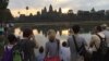 International tourists take photos of Angkor Wat temple as the sun rise in Siem Reap, Cambodia, on Sunday, January 10, 2016. (Hul Reaksmey/VOA Khmer) 