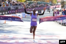 Sheila Chepkirui of Kenya crosses the finish line to win the women's division during the New York Marathon in New York City on Nov. 3, 2024.