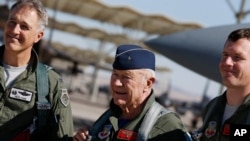 Retired Air Force Brig. Gen. Charles Yeager, center, poses for photos with pilots David Vincent, right, and Pete Ford, left, following a re-enactment flight commemorating Yeager's breaking of the sound barrier, Oct. 14, 2012.