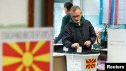 A man casts his ballot for the presidential election in Skopje, North Macedonia, May 5, 2019.