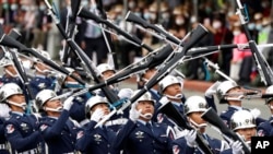 FILE - The military honor guard performs during the National Day celebrations in Taipei, Taiwan, Oct. 10, 2020. 