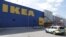 A police vehicle is seen near the entrance of the IKEA store in Vasteras, Sweden, Aug. 10, 2015, after a knife attack at the store. 