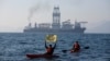 FILE - Greenpeace activists from New Zealand and Mexico confront a deep-sea mining vessel commissioned by Canadian miner The Metals Company, as it returned from test mining for minerals in the Clarion-Clipperton Zone, Nov. 16, 2022. 