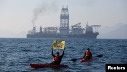 FILE - Greenpeace activists from New Zealand and Mexico confront a deep-sea mining vessel commissioned by Canadian miner The Metals Company, as it returned from test mining for minerals in the Clarion-Clipperton Zone, Nov. 16, 2022. 