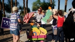 FILE - People protest, Aug. 4, 2020, in Las Vegas against a law signed this week by Nevada Gov. Steve Sisolak to mail ballots to all of the state's active voters ahead of the November election. 
