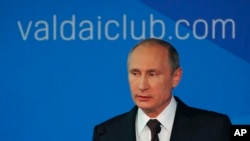 Russian President Vladimir Putin speaks to political experts at a meeting of the Valdai International Discussion Club in Sochi, Russia, Oct. 24, 2014.