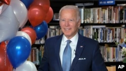 In this image from video, Democratic presidential candidate Joe Biden smiles after the roll call vote during the second night of the Democratic National Convention, Aug. 18, 2020.