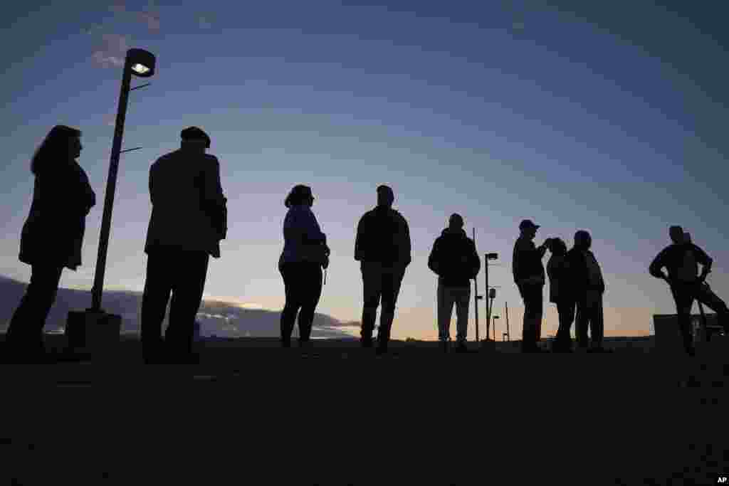 Voters wait in line to cast their ballots at Scranton High School in Scranton, Pennsylvania, Nov. 5, 2024.