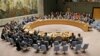 FILE - Members of the United Nations Security Council vote on a resolution during a meeting at U.N. headquarters, Feb. 28, 2019.