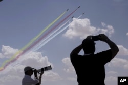 Photographers film Chinese J-10 fighter jets during the Egypt International Airshow at El Alamein International Airport, Sept. 4, 2024.