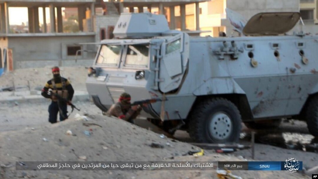 FILE - This photo posted on a file sharing website Jan. 11, 2017, by the Islamic State Group in Sinai shows a deadly attack by militants on an Egyptian police checkpoint, Jan. 9, 2017, in el-Arish, north Sinai, Egypt.