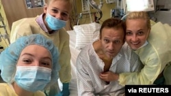 FILE - Russian opposition politician Alexei Navalny and his family members pose for a picture at Charite hospital in Berlin, Germany, in this undated image obtained from social media, Sept. 15, 2020. (Courtesy of Instagram @NAVALNY/Social Media)
