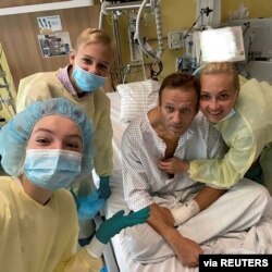 FILE - Russian opposition politician Alexei Navalny and his family members pose for a picture at Charite hospital in Berlin, Germany, in this undated image obtained from social media, Sept. 15, 2020. (Courtesy of Instagram @NAVALNY/Social Media)
