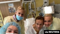 Russian opposition politician Alexei Navalny and his family members pose for a picture at Charite hospital in Berlin, Germany, in this undated image obtained from social media, Sept. 15, 2020. (Courtesy of Instagram @NAVALNY/Social Media)