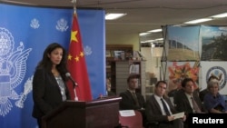 U.S. Acting Assistant Secretary of State for Democracy, Human Rights and Labor Uzra Zeya (L) speaks to reporters at a news briefing on the latest U.S.-China Human Rights Dialogue in Beijing, August 2013.