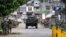 Philippine marines walk to the frontline in the continuing assaults to retake control of some areas of Marawi city, May 28, 2017, in southern Philippines